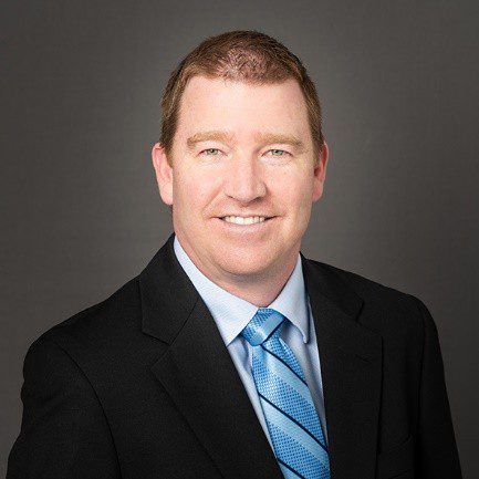 Man in suit with blue tie